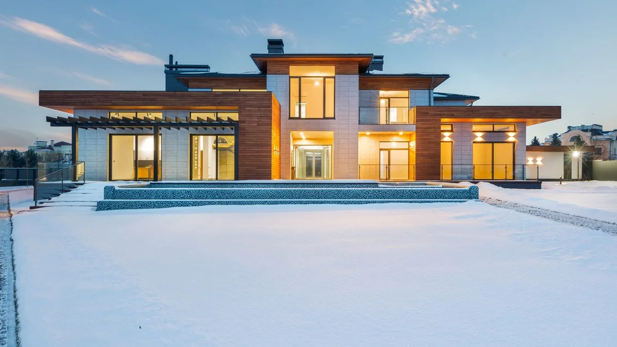 A Las Vegas home at twilight with warm lights on, the kind buyers finance with a conventional loan
