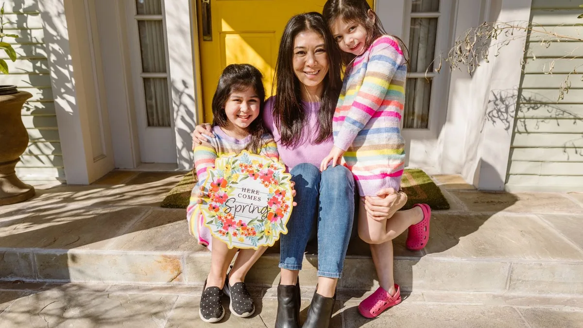 A Nevada mother with her children at home, weighing a conventional loan against FHA