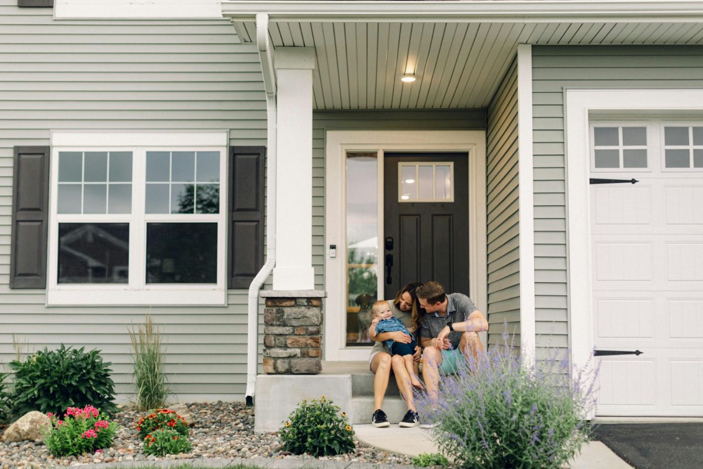 A Las Vegas family in front of their home, protected by Valley West Insurance
